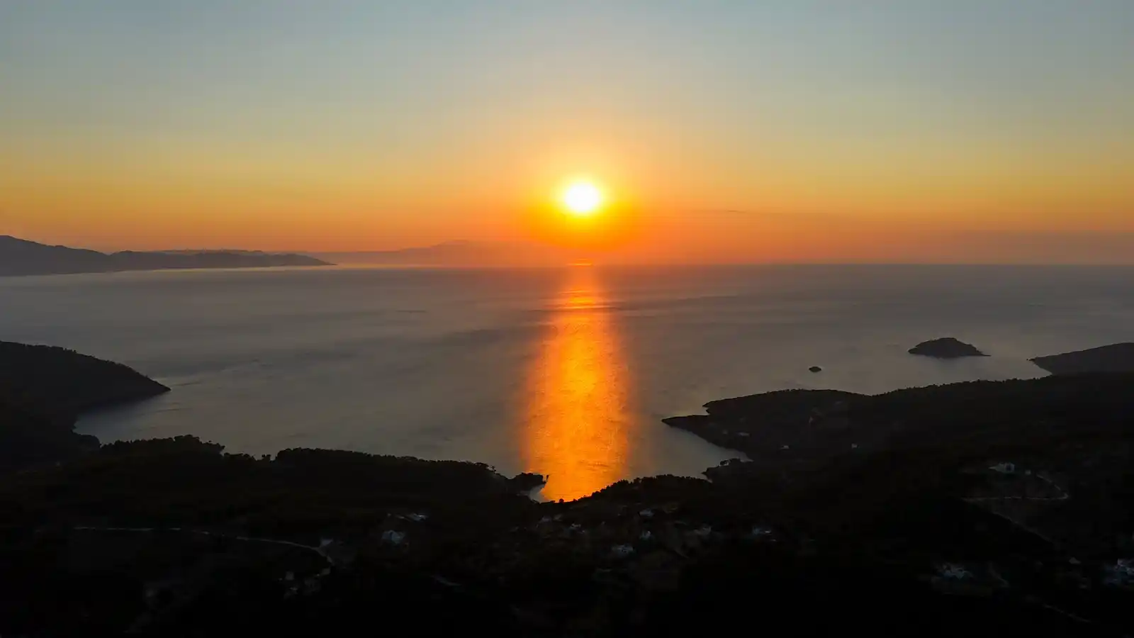 Sun setting over the sea and small islands, seen from the hills of Alonnisos