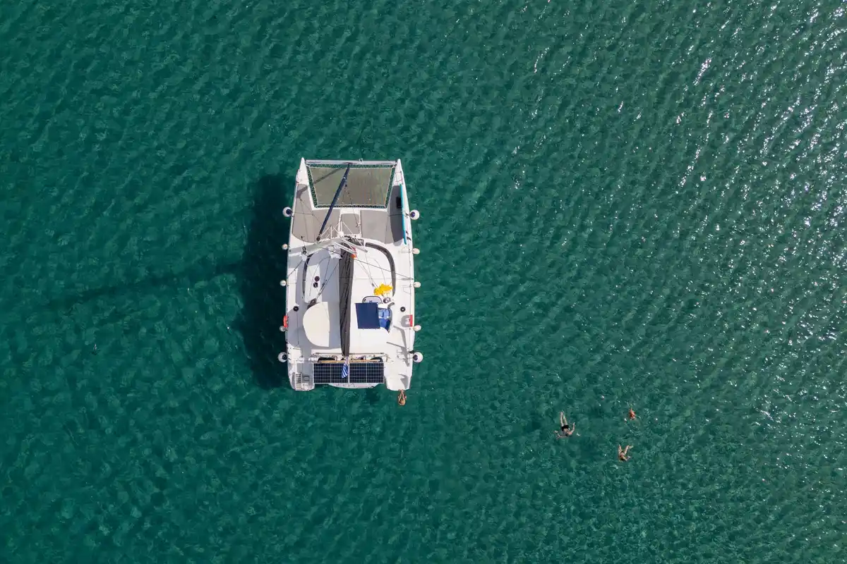 Lavezzi 40 Victoria from directly above, at anchor in green blue water off Sithonia, swimmers nearby